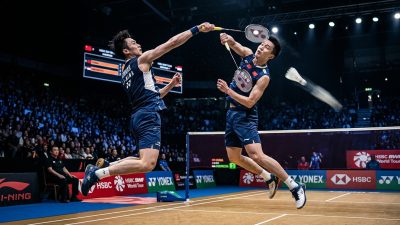 Indian badminton player executing powerful smash on BWF World Tour court