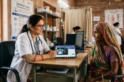 Indian doctor using AI diagnostic tool for rural telemedicine consultation