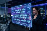 AI interface displaying Indian language scripts on holographic screen in Bangalore tech office