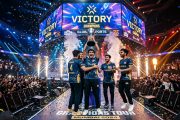 Indian esports team celebrating victory on tournament stage with LED screens and confetti