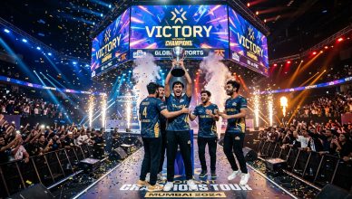 Indian esports team celebrating victory on tournament stage with LED screens and confetti