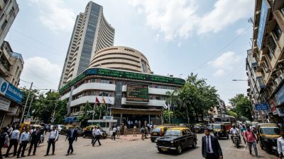 Traders monitoring stock market screens as Sensex hits 95000 record high