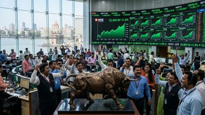 Indian stock exchange trading floor with green rising charts during Q4 FY26 earnings rally