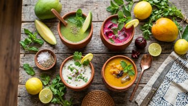 Traditional Indian summer cooling drinks aam panna kokum sattu bel sherbet in clay glasses