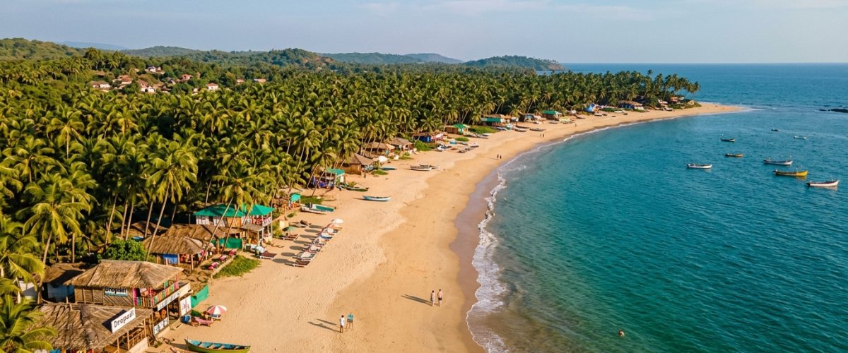 Serene Goa beach in April off-season with golden sand and calm turquoise Arabian Sea