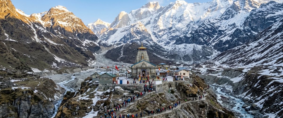 Himalayan temple shrine among snow-capped mountains with pilgrims on mountain path