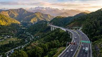 Aerial view of Delhi-Dehradun Expressway six-lane highway through Uttarakhand hills
