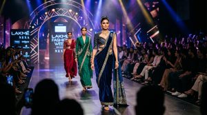 Indian fashion runway scene with models in indo-western fusion outfits and pre-draped sarees