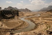 Indian reservoir showing critically low water levels with exposed dry lakebed
