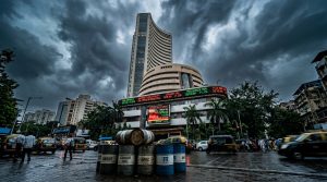 Bombay Stock Exchange building with digital stock ticker displays showing market volatility