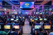 Indian indie game developers showcasing PC games at a vibrant gaming festival with Steam branding
