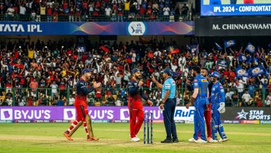 IPL 2026 cricket match with players and umpires in heated discussion under stadium floodlights