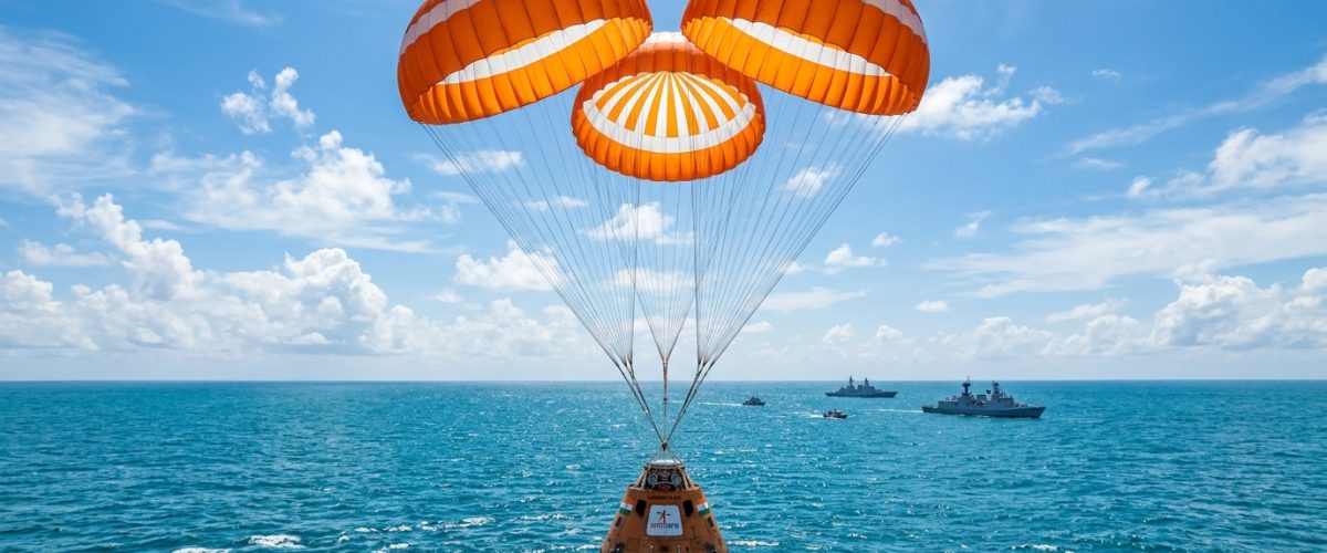 ISRO Gaganyaan crew module descending with parachutes during air drop test