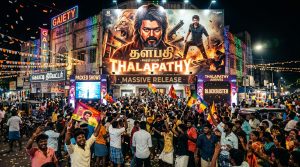 South Indian cinema poster display with packed movie theater entrance and colorful lights