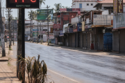 Empty Kerala street during midday self-lockdown as digital display shows 41 degrees during heatwave