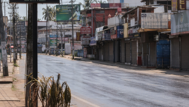 Empty Kerala street during midday self-lockdown as digital display shows 41 degrees during heatwave