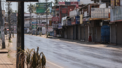 Empty Kerala street during midday self-lockdown as digital display shows 41 degrees during heatwave