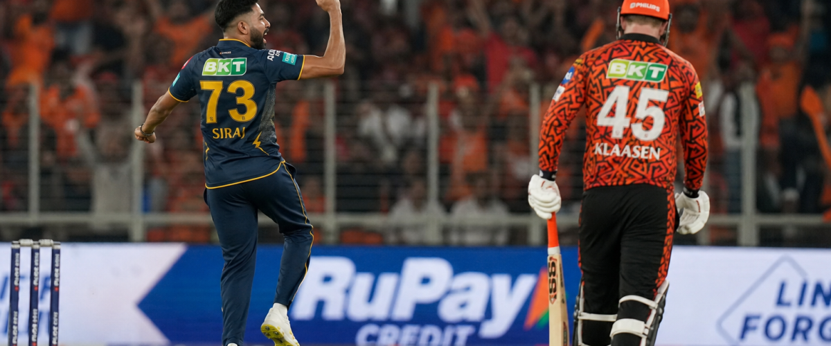 IPL cricket match at packed Narendra Modi Stadium under floodlights with Gujarat Titans vs Sunrisers Hyderabad