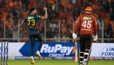 IPL cricket match at packed Narendra Modi Stadium under floodlights with Gujarat Titans vs Sunrisers Hyderabad