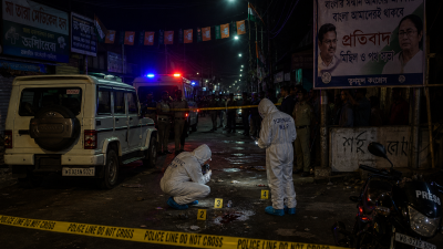 Police forensic team examining crime scene in Madhyamgram after Chandranath Rath shooting